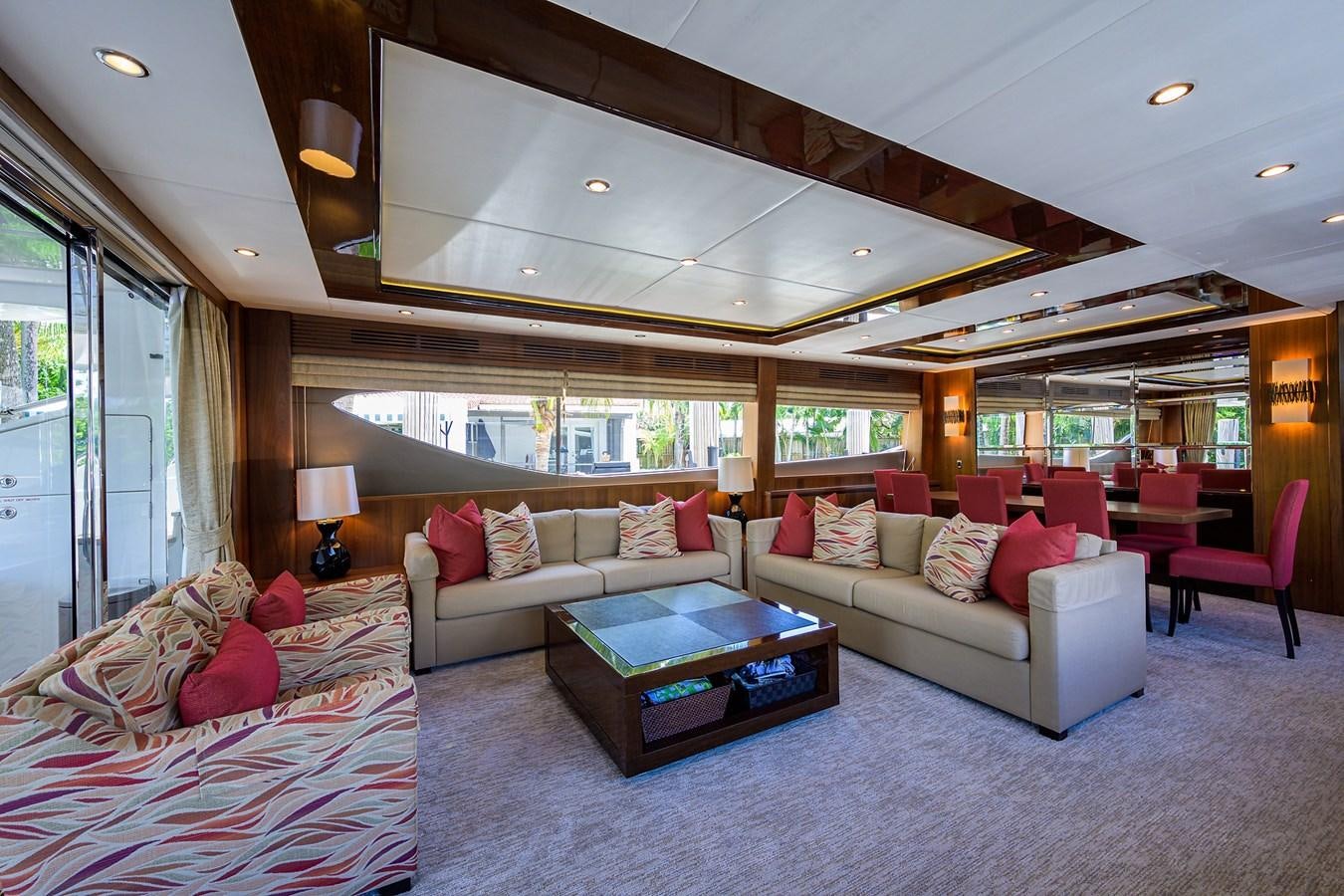 a living room with a couch and a coffee table aboard FREUDIAN SLIP Yacht for Sale