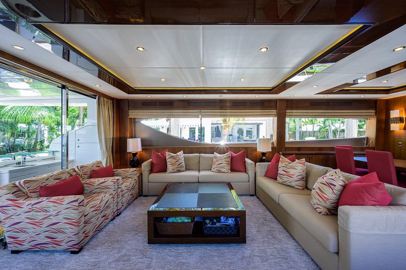 a living room with a couch and a coffee table aboard FREUDIAN SLIP Yacht for Sale