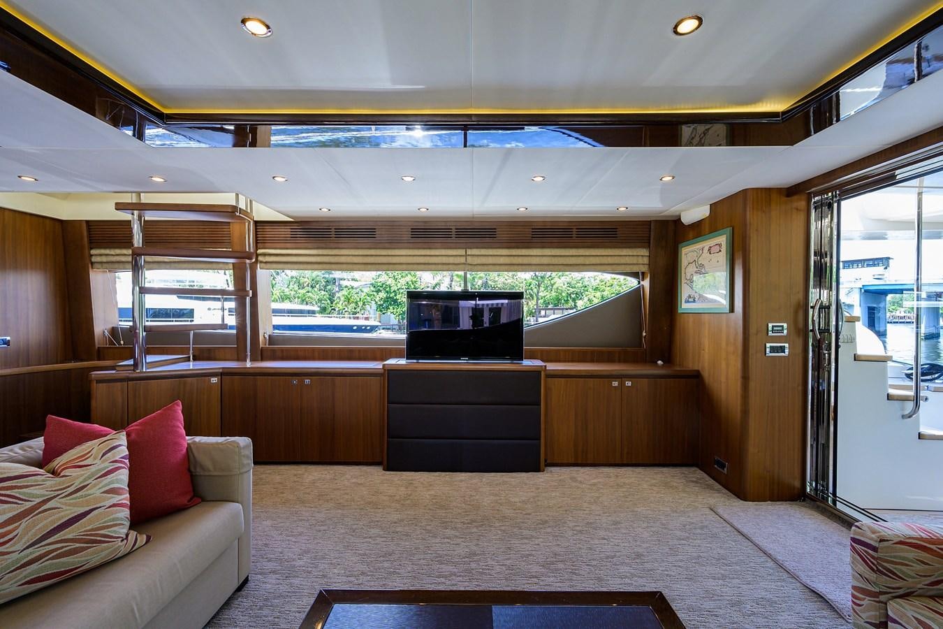 a room with a couch and a tv aboard FREUDIAN SLIP Yacht for Sale