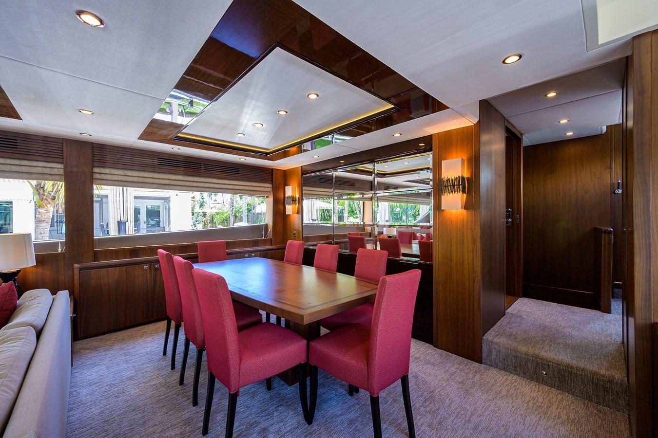 a room with a table and chairs aboard FREUDIAN SLIP Yacht for Sale