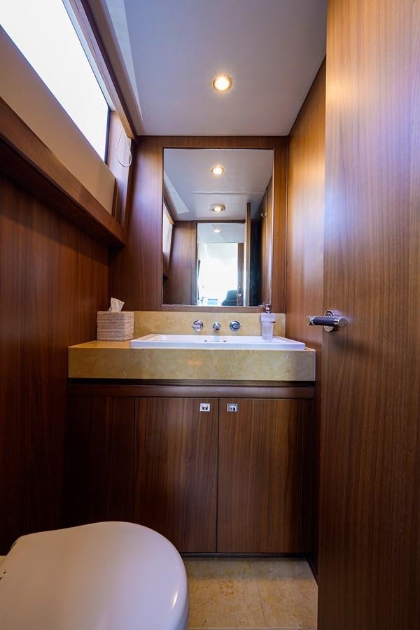 a bathroom with a sink and a mirror aboard FREUDIAN SLIP Yacht for Sale