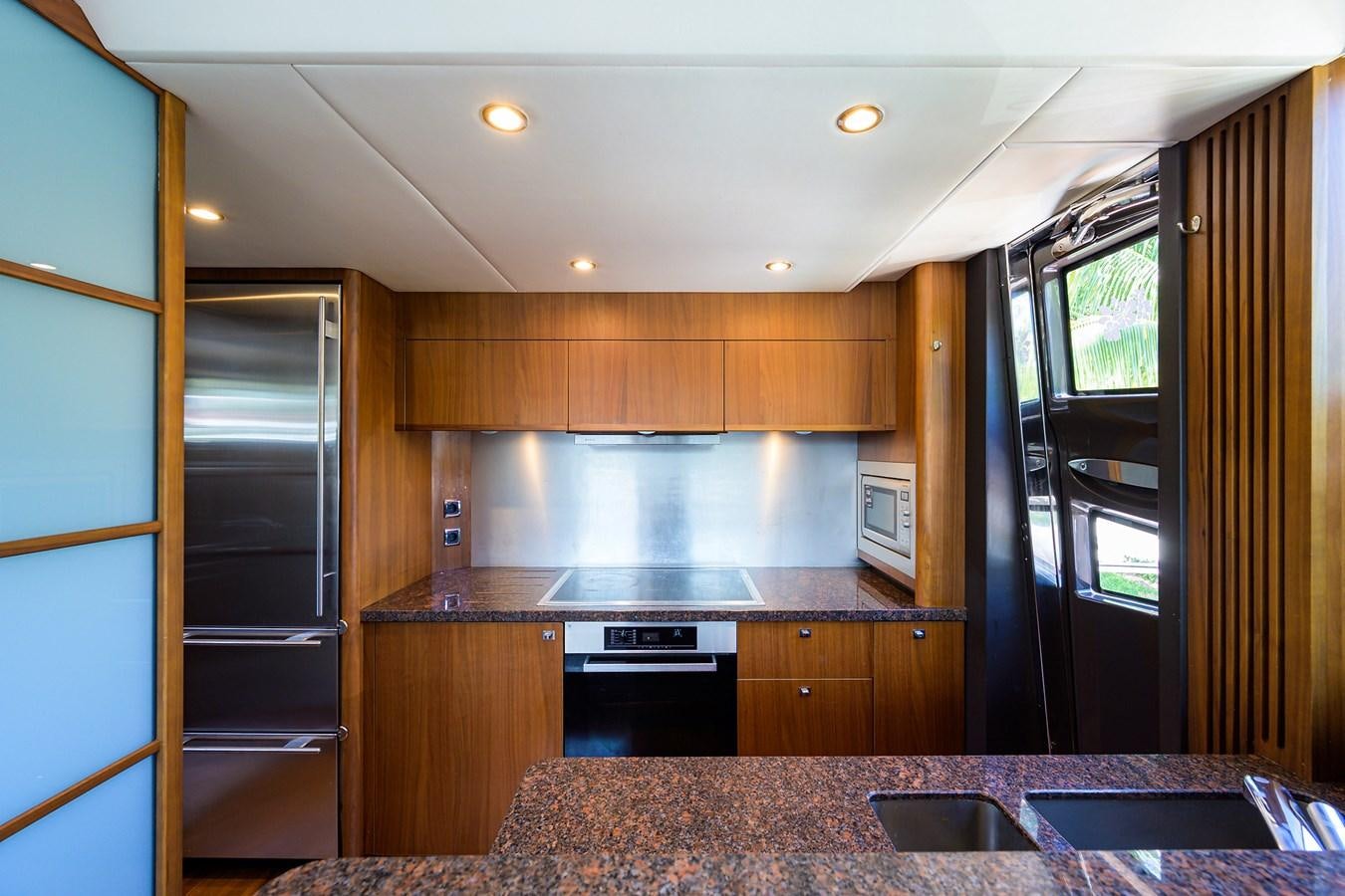 a kitchen with a marble counter top aboard FREUDIAN SLIP Yacht for Sale