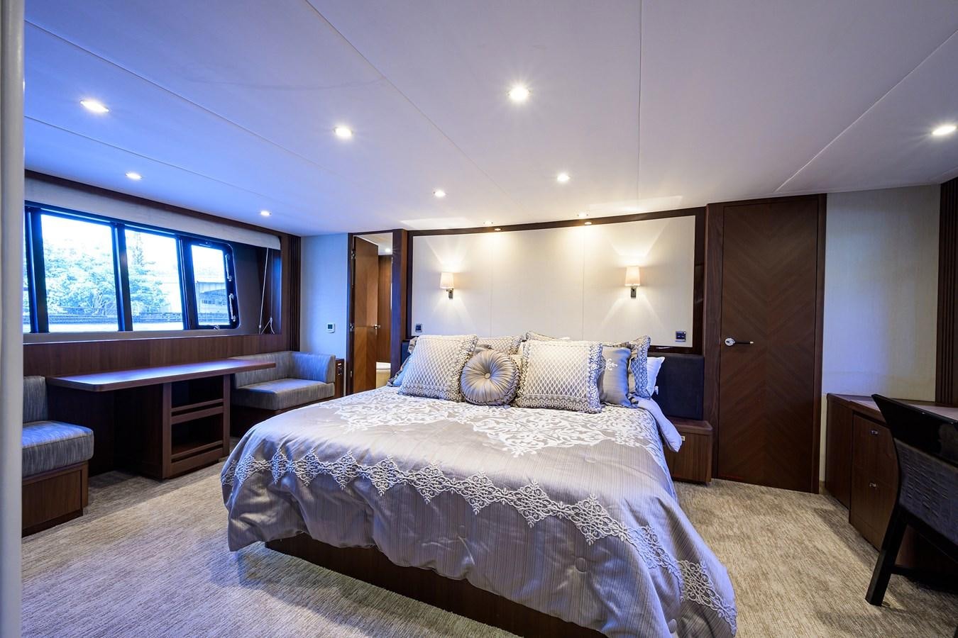 a large bedroom with a large bed aboard FREUDIAN SLIP Yacht for Sale