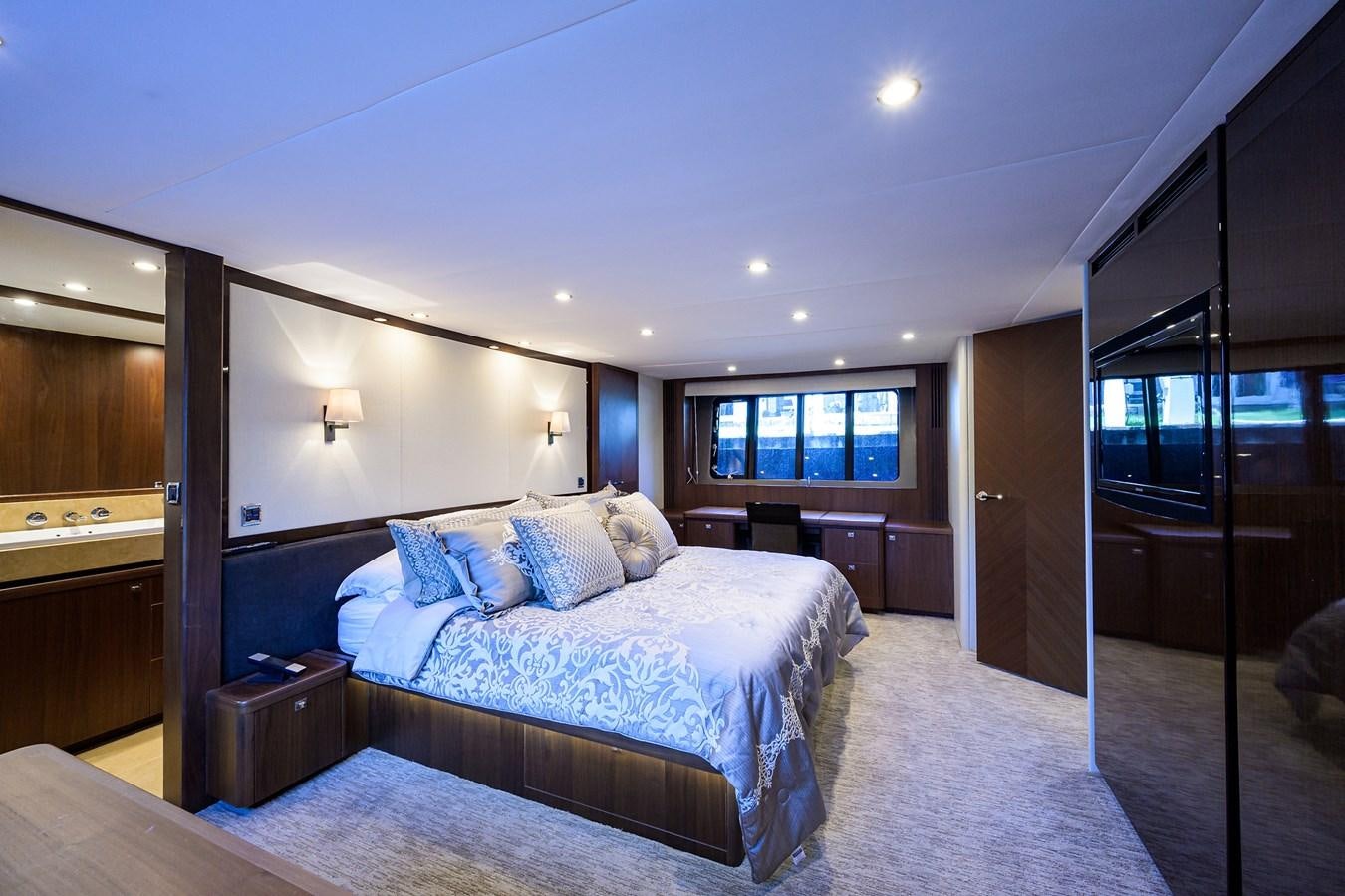 a bedroom with a large bed aboard FREUDIAN SLIP Yacht for Sale