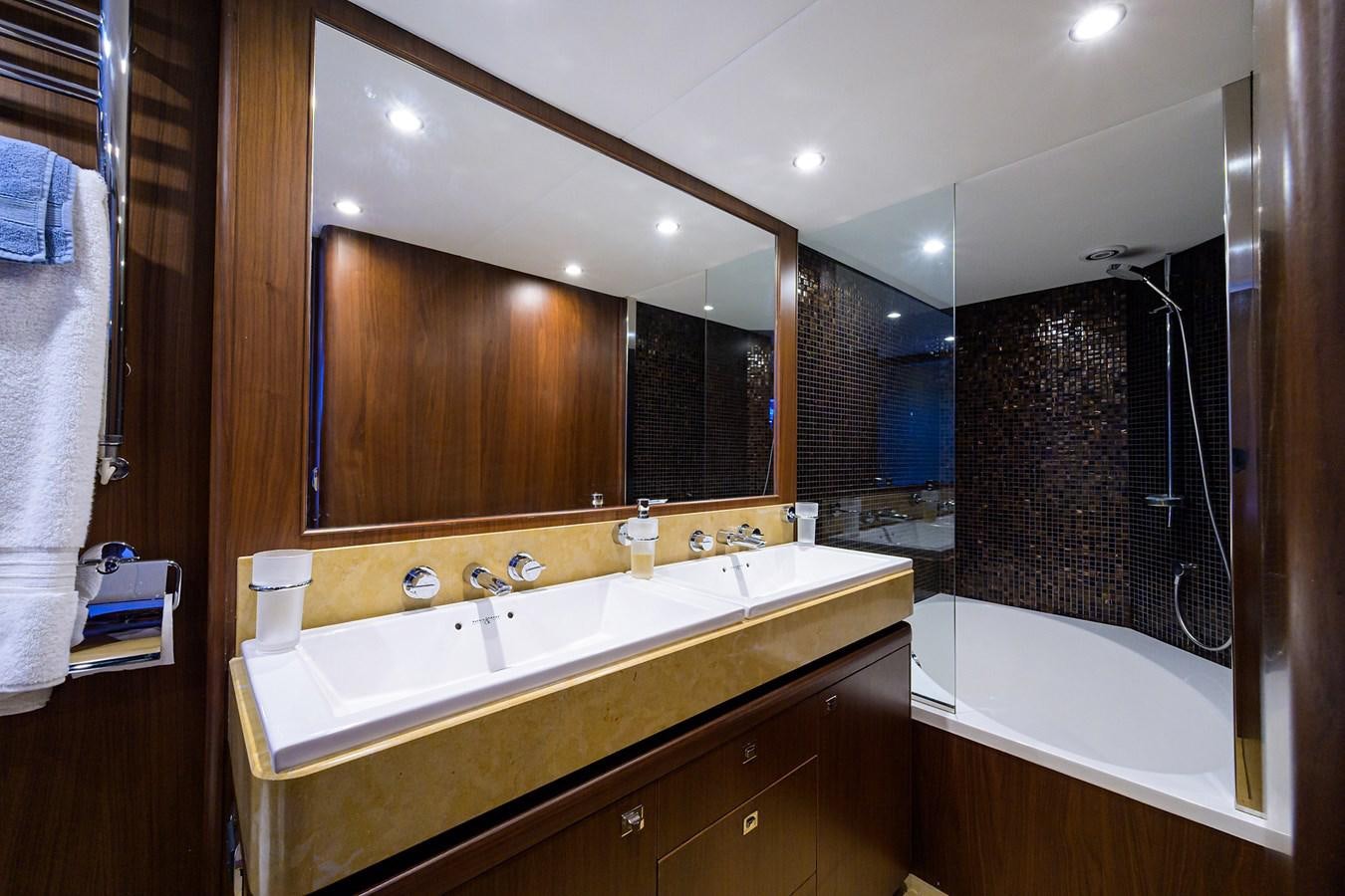 a bathroom with a large mirror aboard FREUDIAN SLIP Yacht for Sale