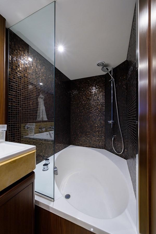 a bathroom with a sink and a shower aboard FREUDIAN SLIP Yacht for Sale