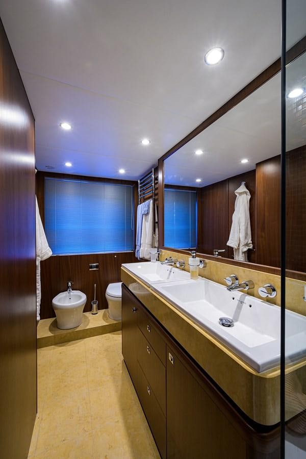 a bathroom with a large mirror aboard FREUDIAN SLIP Yacht for Sale