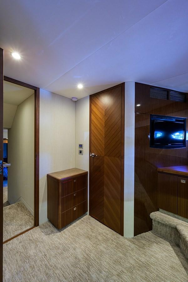 a room with a tv and a bed aboard FREUDIAN SLIP Yacht for Sale