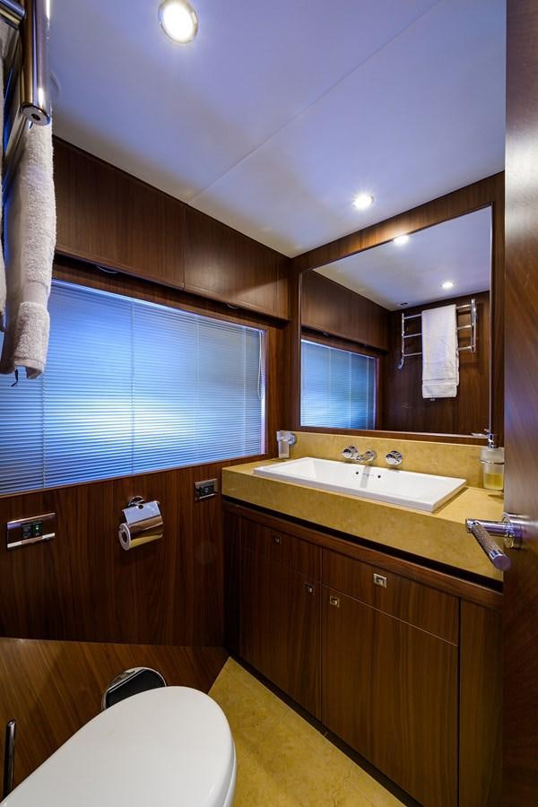 a bathroom with a sink and a mirror aboard FREUDIAN SLIP Yacht for Sale