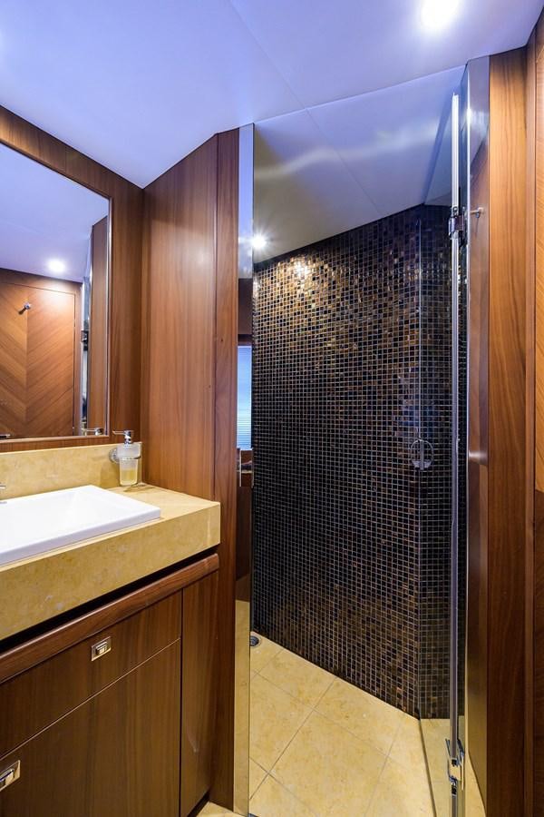 a bathroom with a sink and a shower unit aboard FREUDIAN SLIP Yacht for Sale