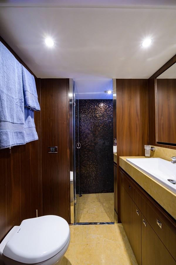 a bathroom with a shower curtain aboard FREUDIAN SLIP Yacht for Sale