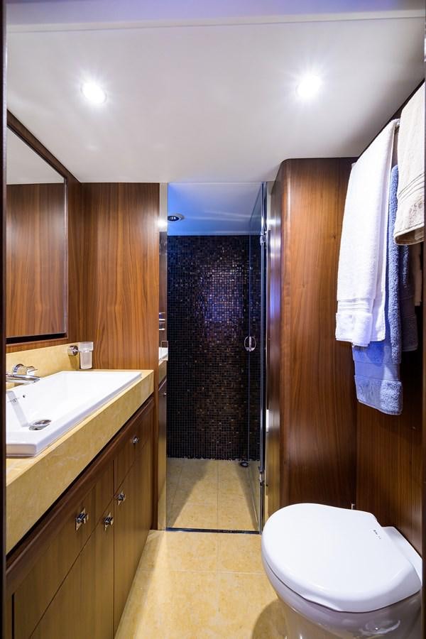 a bathroom with a toilet and sink aboard FREUDIAN SLIP Yacht for Sale