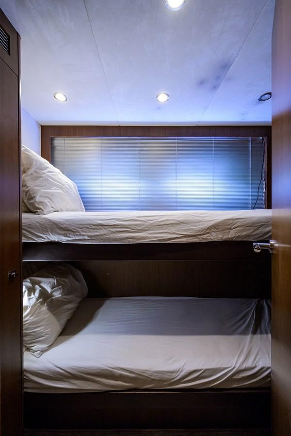 a bed with white sheets aboard FREUDIAN SLIP Yacht for Sale