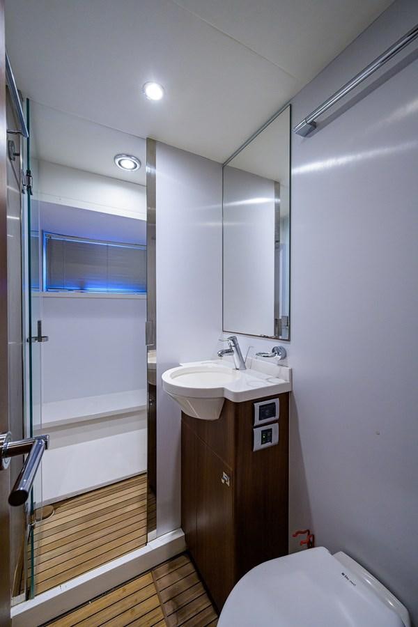 a bathroom with a sink and a shower aboard FREUDIAN SLIP Yacht for Sale