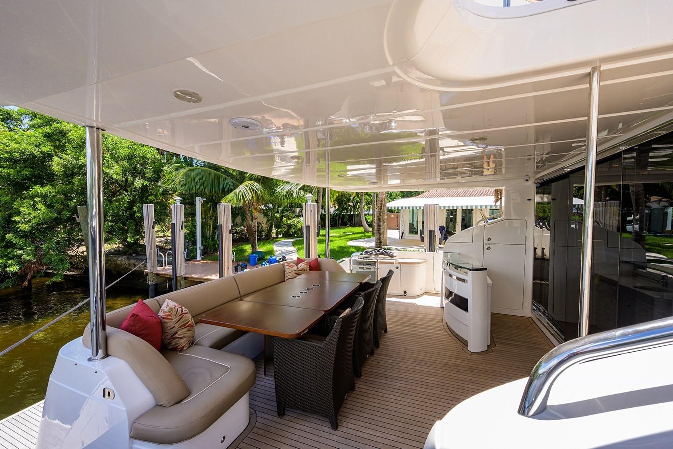 a boat with a table and chairs aboard FREUDIAN SLIP Yacht for Sale