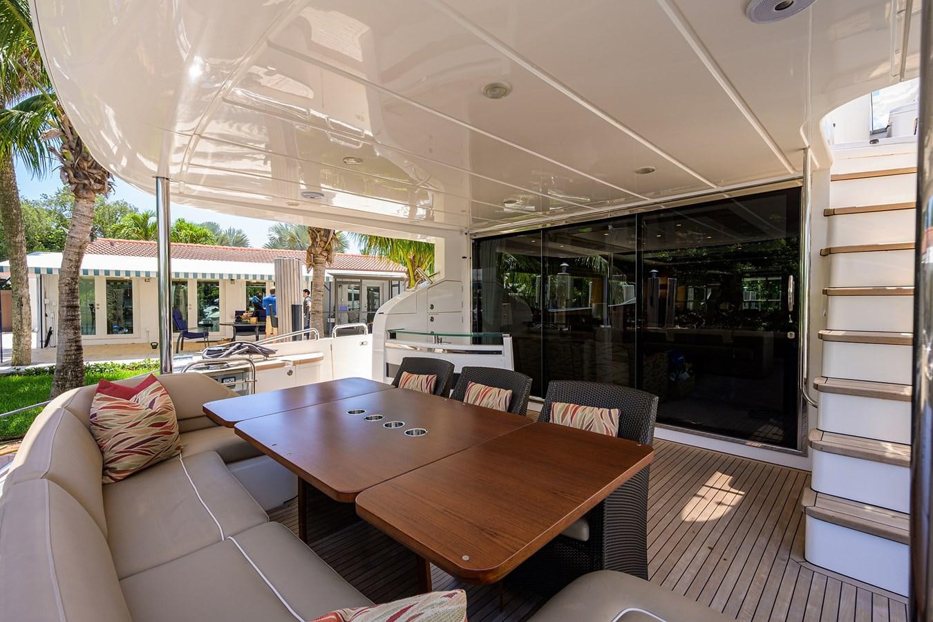 a room with a table and couches aboard FREUDIAN SLIP Yacht for Sale