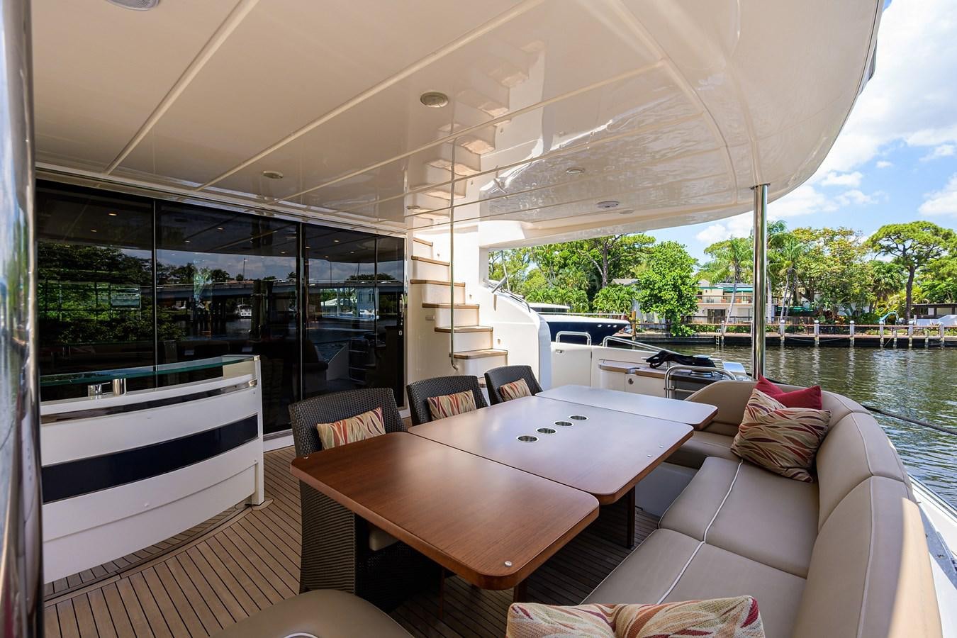 a large room with a table and chairs aboard FREUDIAN SLIP Yacht for Sale