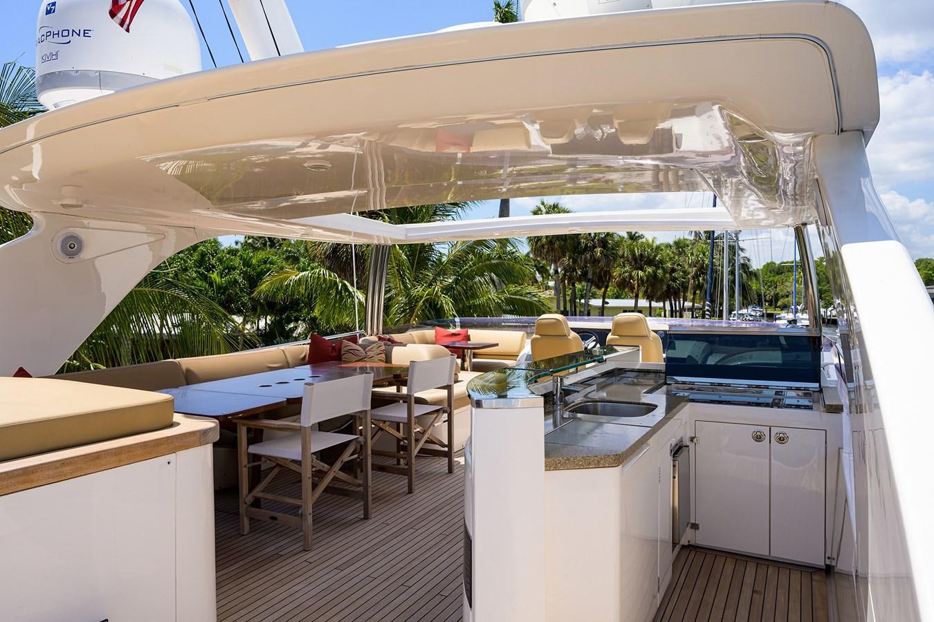 a large white tent with tables and chairs aboard FREUDIAN SLIP Yacht for Sale