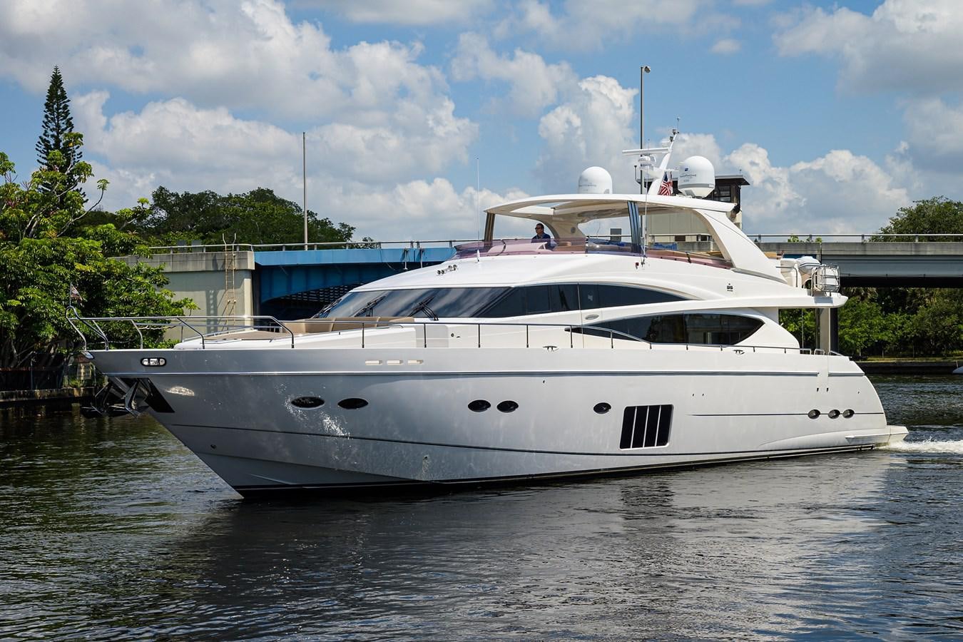 a white yacht in a harbor aboard FREUDIAN SLIP Yacht for Sale