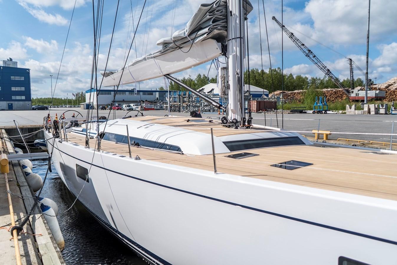 a white boat in a harbor aboard SULITA Yacht for Sale