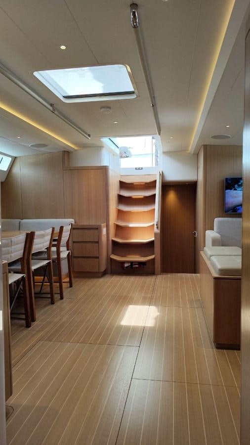 a room with a wood floor and a wood door and a wood cabinet aboard SULITA Yacht for Sale