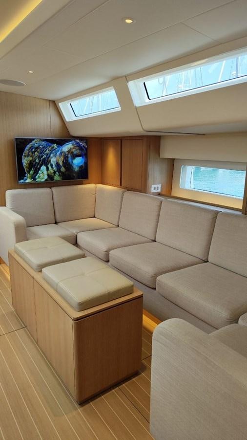 a living room with a large painting aboard SULITA Yacht for Sale