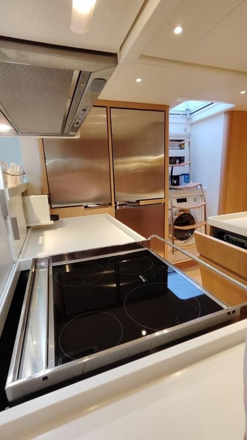 a kitchen with a stove and oven aboard SULITA Yacht for Sale