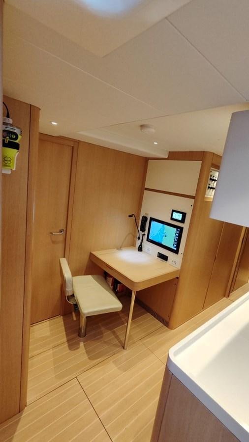 a small bathroom with a desk and a tv aboard SULITA Yacht for Sale