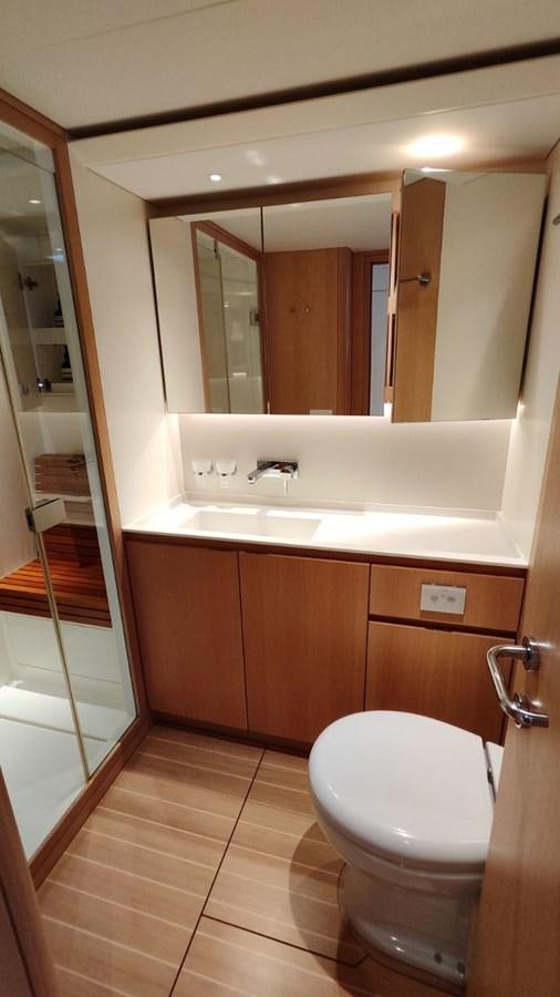 a bathroom with a glass shower door aboard SULITA Yacht for Sale