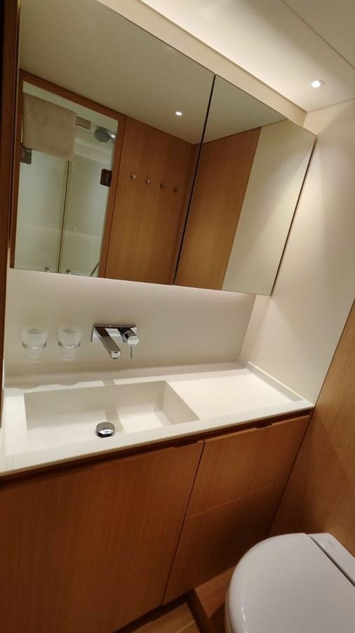 a bathroom with a large mirror aboard SULITA Yacht for Sale