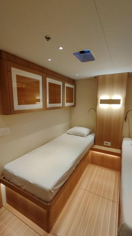 a bed with a white sheet aboard SULITA Yacht for Sale
