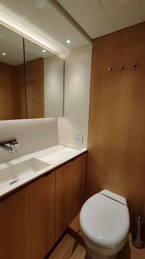 a bathroom with a toilet and a sink aboard SULITA Yacht for Sale