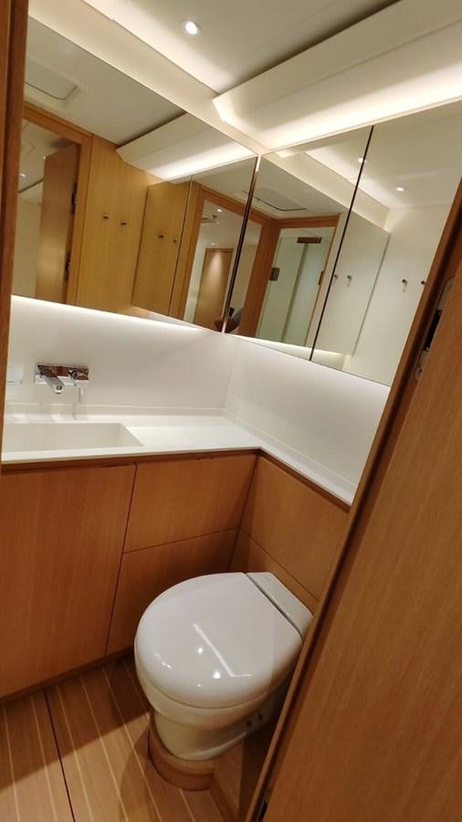 a bathroom with a toilet and a sink aboard SULITA Yacht for Sale