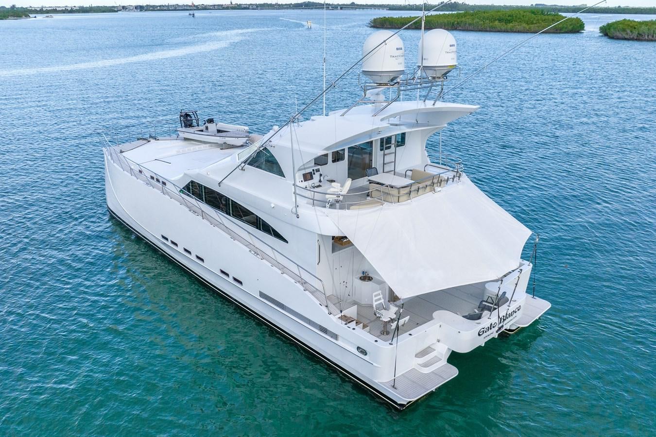 a white boat on the water aboard GATO BLANCO Yacht for Sale