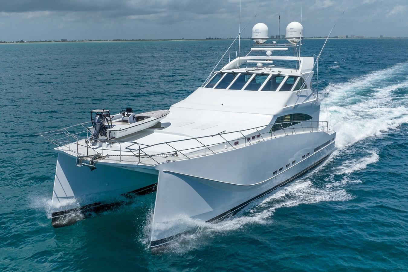 a white yacht on the water aboard GATO BLANCO Yacht for Sale