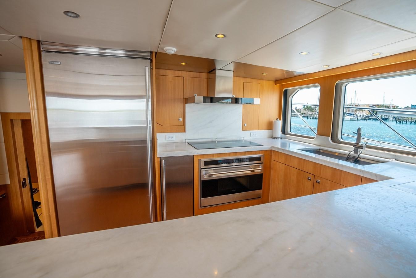 a kitchen with a sliding glass door aboard GATO BLANCO Yacht for Sale