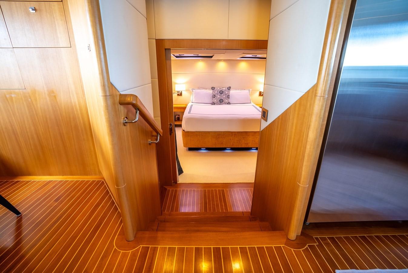 a room with a bed and a door aboard GATO BLANCO Yacht for Sale