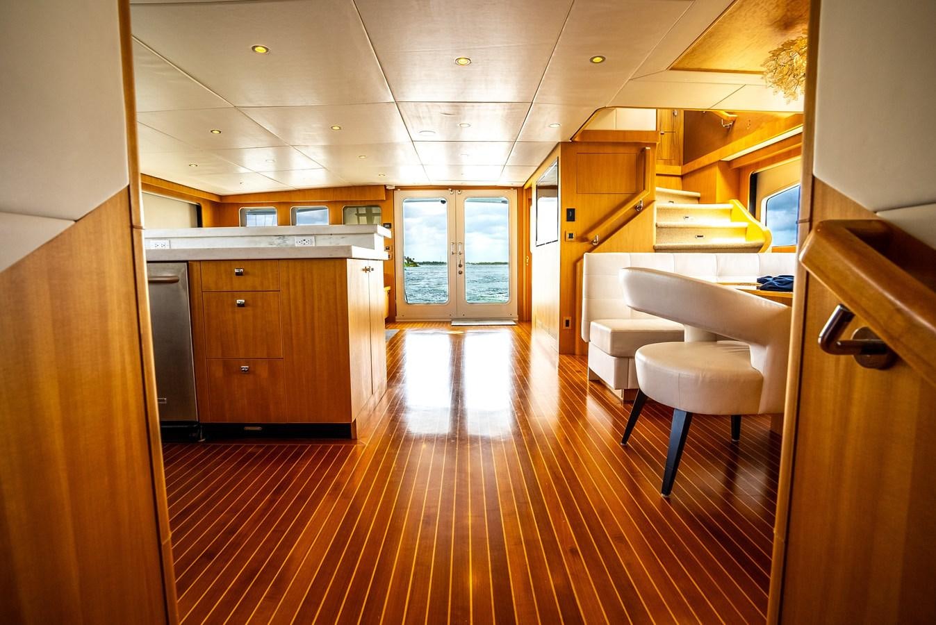 a kitchen with wooden floors aboard GATO BLANCO Yacht for Sale