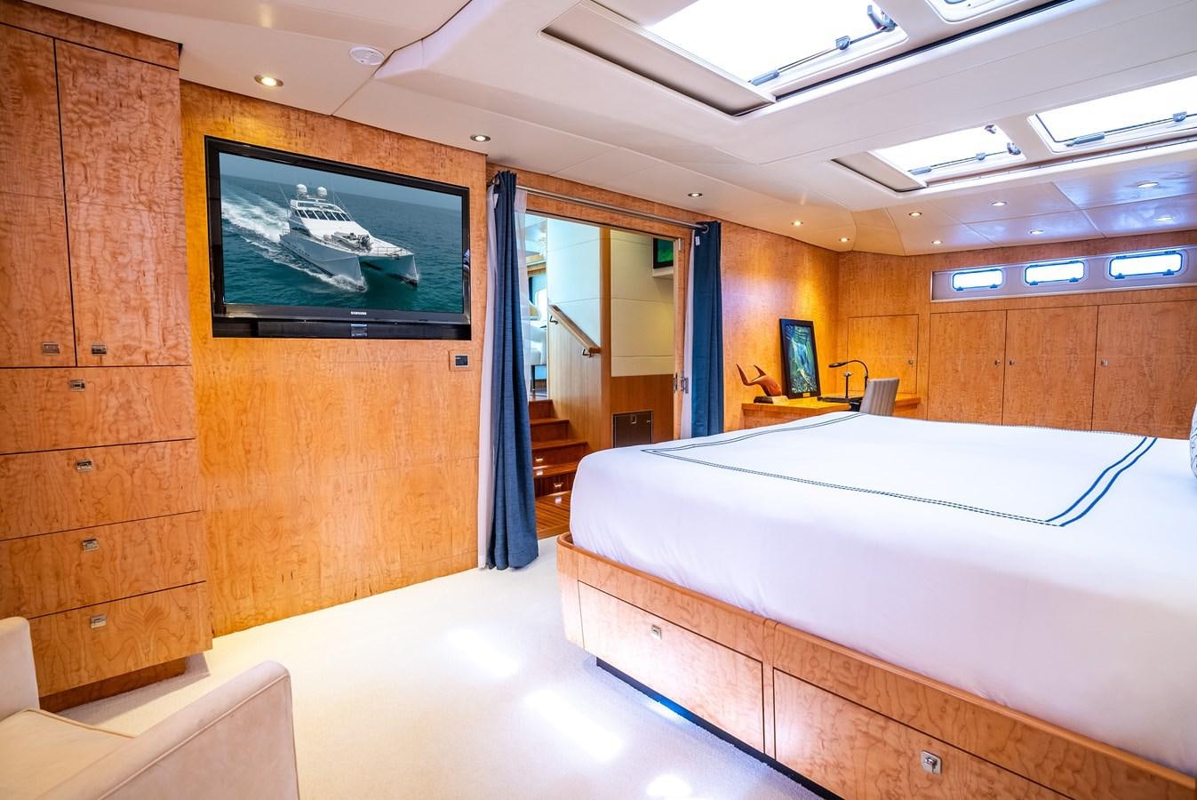 a room with a bed and a desk aboard GATO BLANCO Yacht for Sale