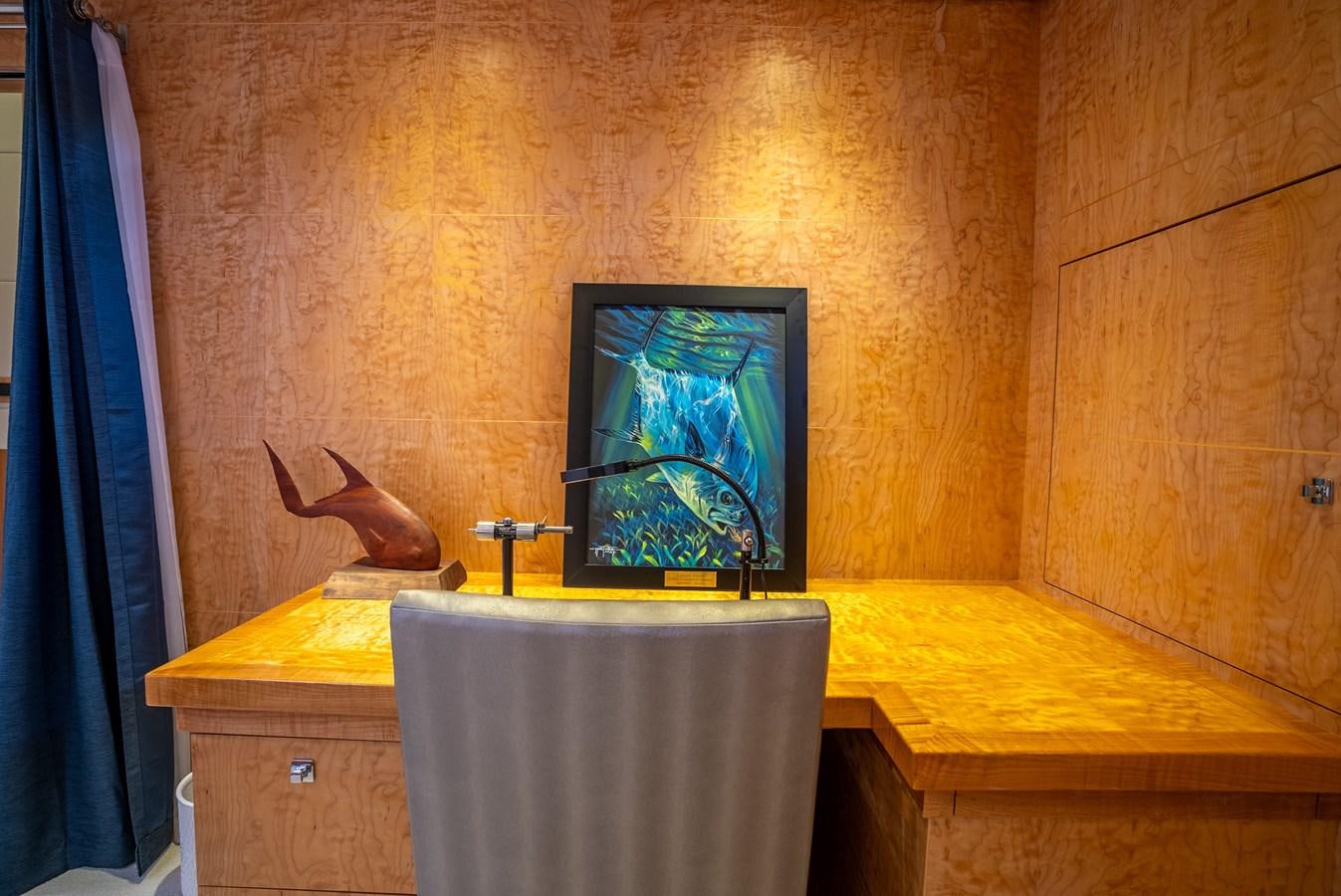 a television on a stand aboard GATO BLANCO Yacht for Sale