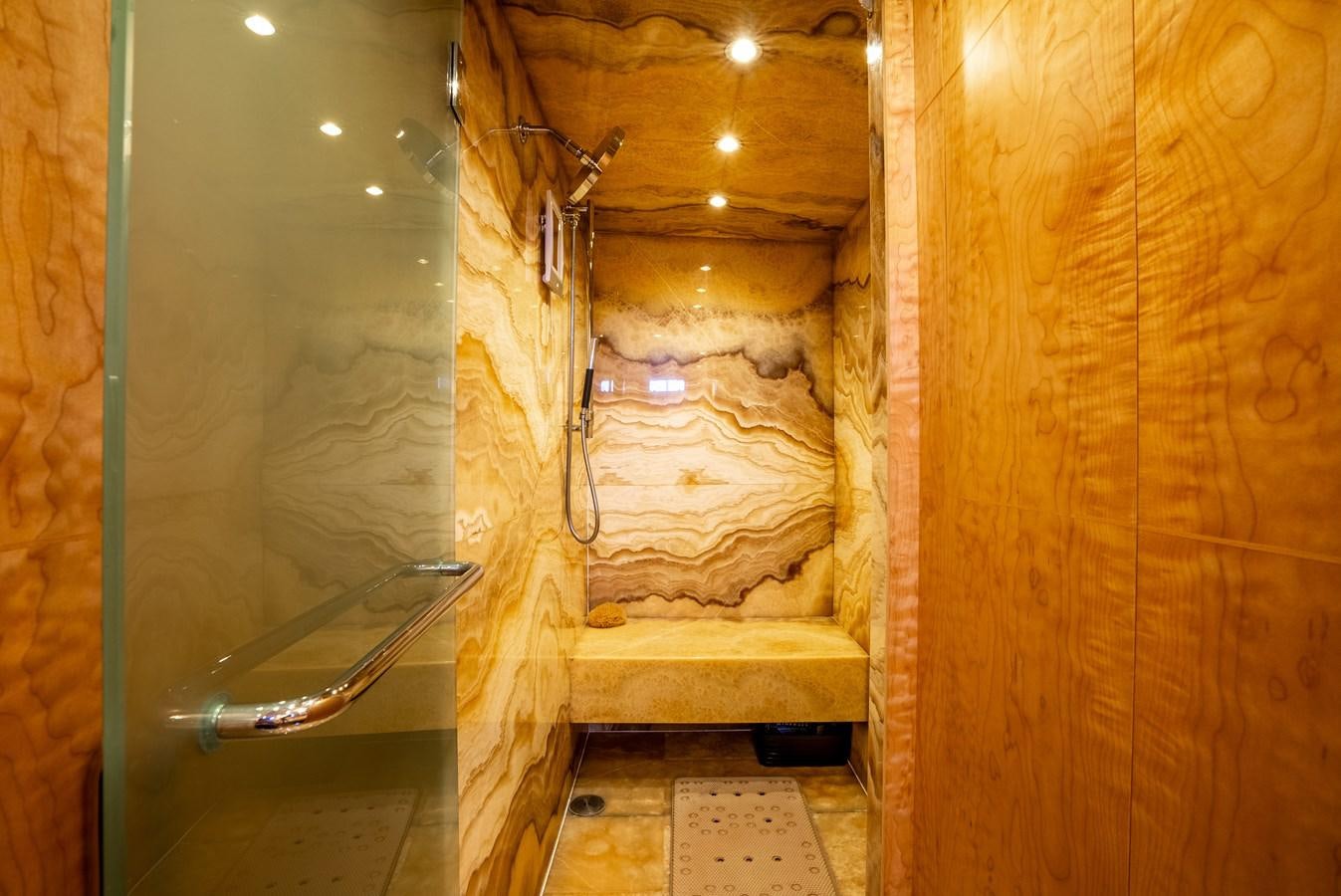a bathroom with a large mirror aboard GATO BLANCO Yacht for Sale
