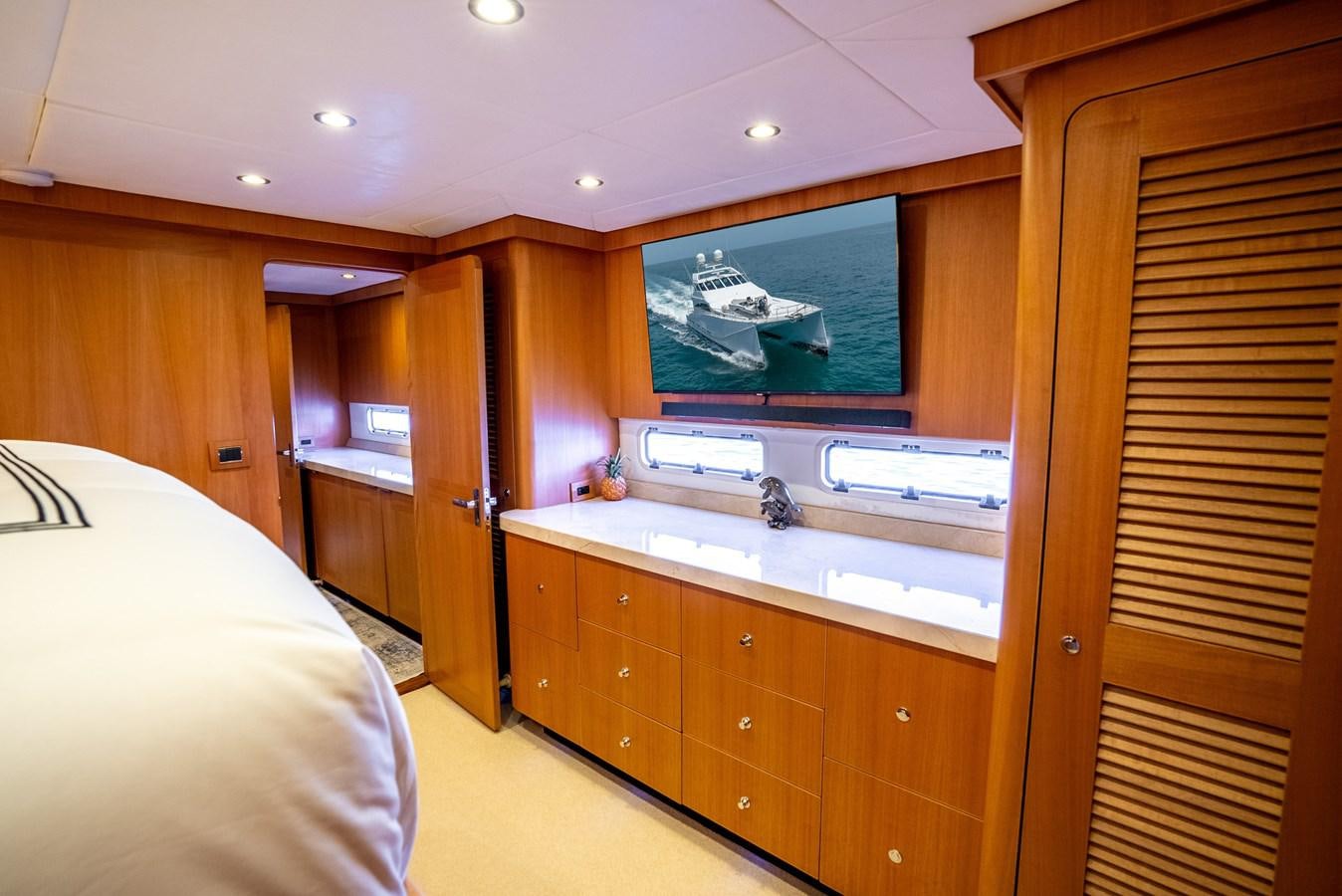 a bedroom with a large window aboard GATO BLANCO Yacht for Sale