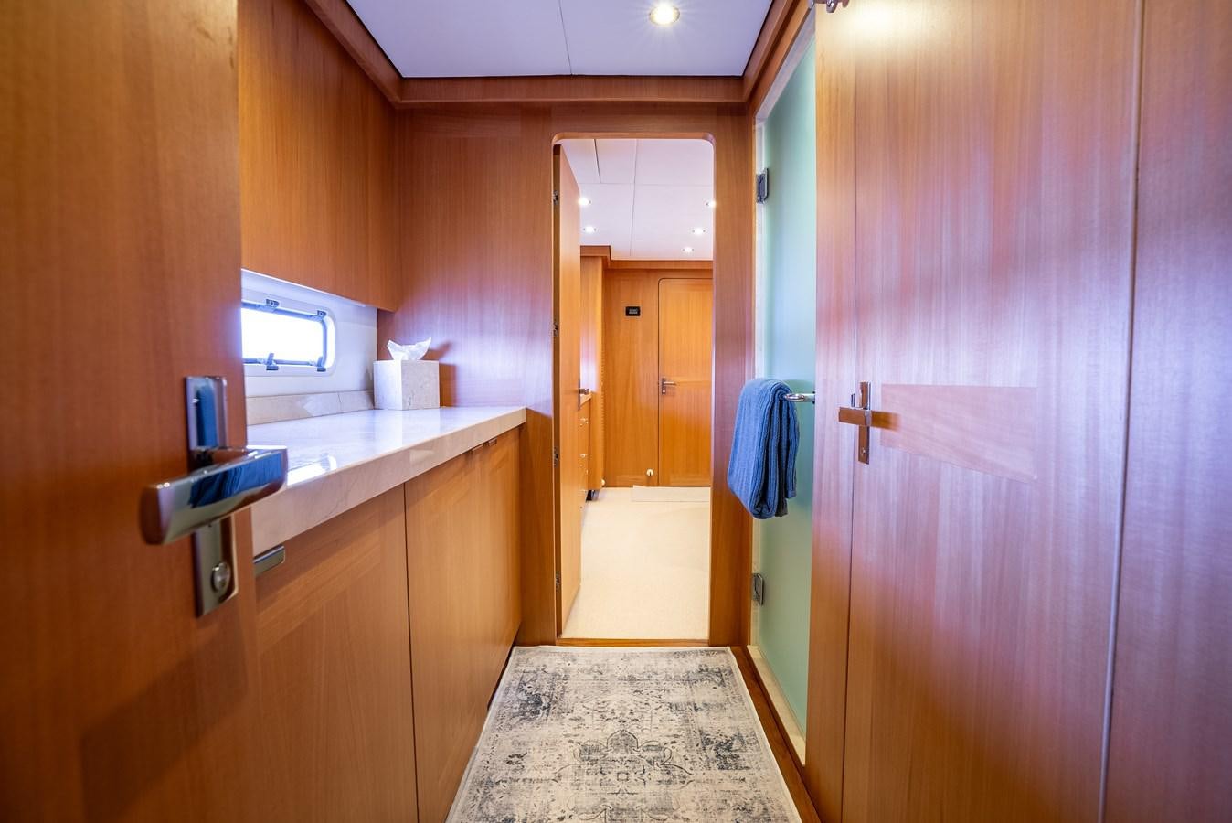 a bathroom with a sink and cabinets aboard GATO BLANCO Yacht for Sale