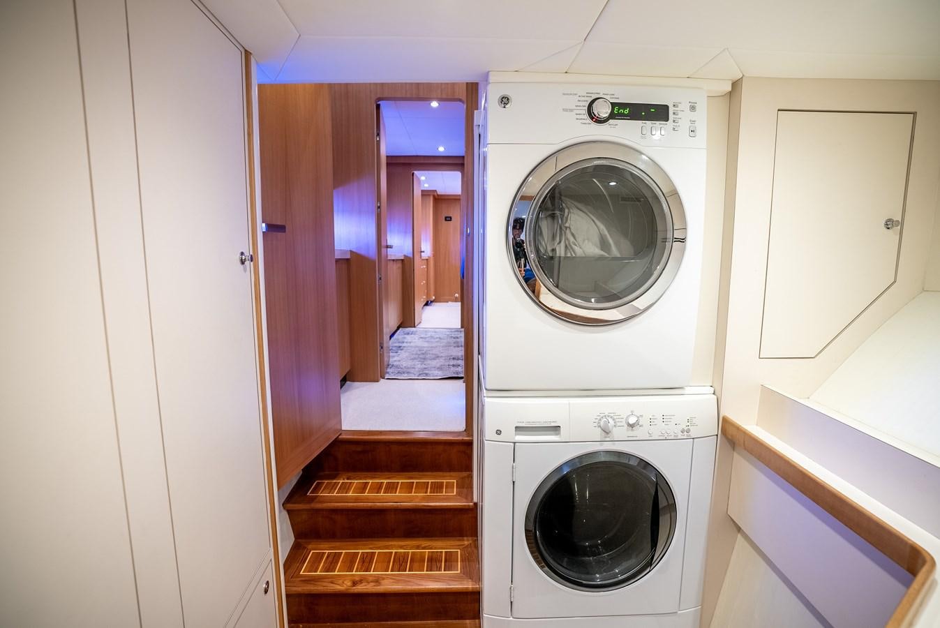 a washer and dryer in a room aboard GATO BLANCO Yacht for Sale