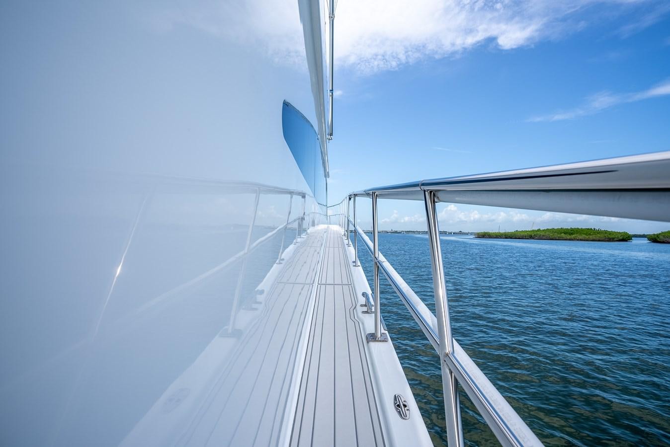 a white boat on water aboard GATO BLANCO Yacht for Sale