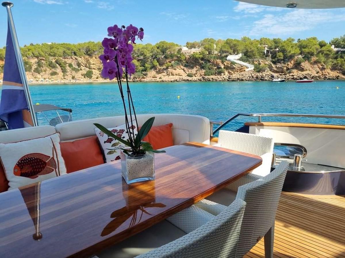 a flower in a pot on a table aboard PLEIADES Yacht for Sale