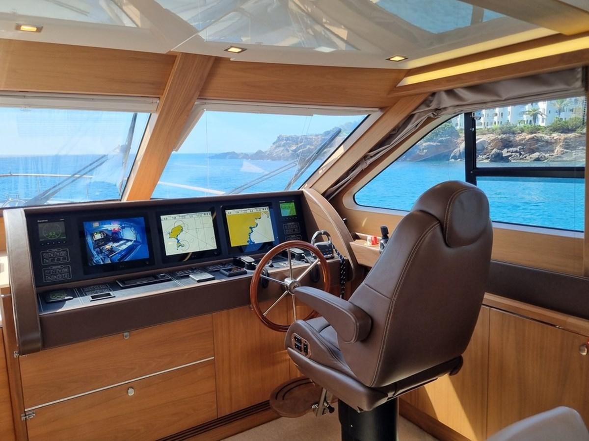 inside of a vehicle with a large window and a view of the water aboard PLEIADES Yacht for Sale