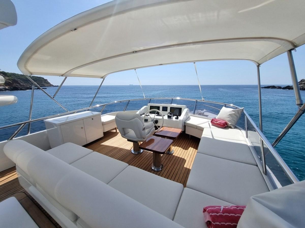 a boat with a chair on the deck aboard PLEIADES Yacht for Sale