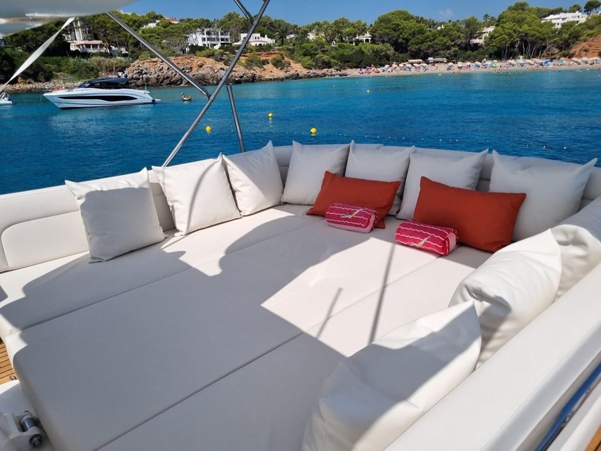 a white couch on a boat aboard PLEIADES Yacht for Sale