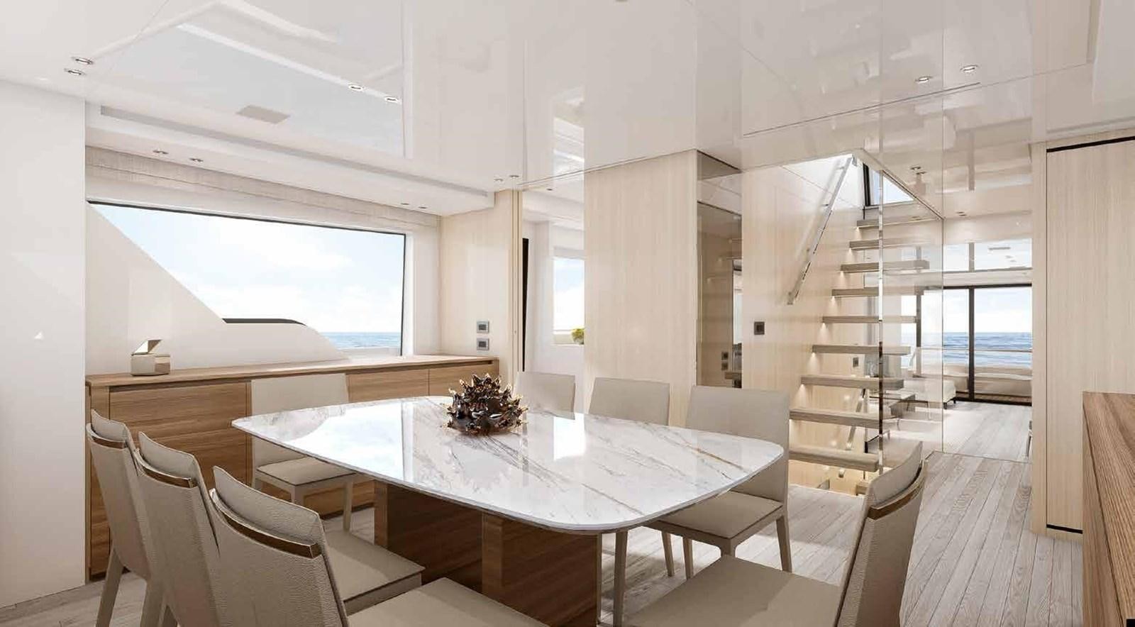 a room with a table and chairs aboard OMNIA Yacht for Sale